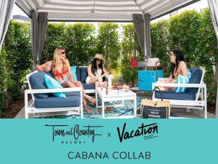 Four people relax in a stylish outdoor cabana by Town and Country Resort x Vacation, featuring comfy seating and sunny decor.